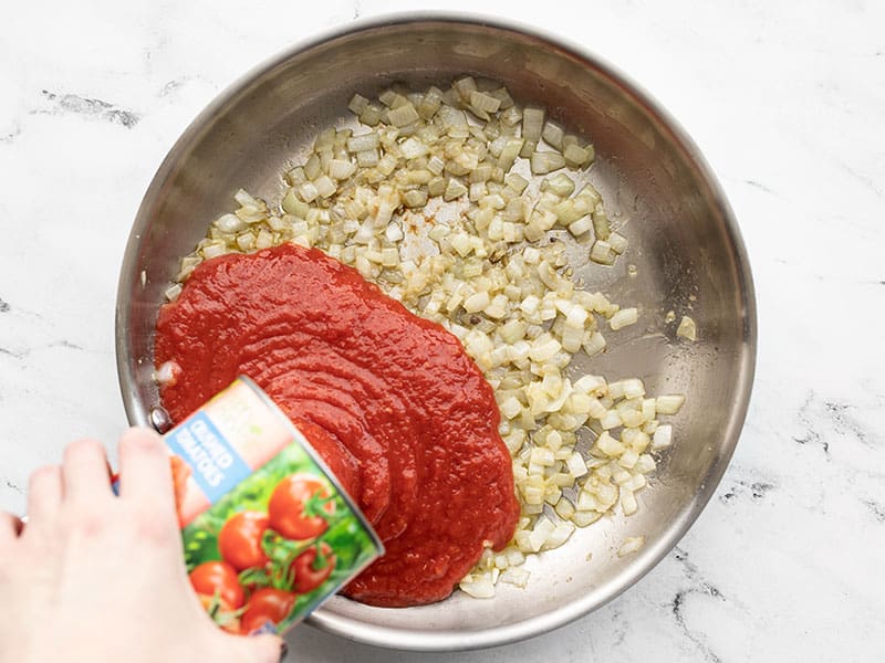 Crushed-Tomatoes-Pouring-into-Skillet