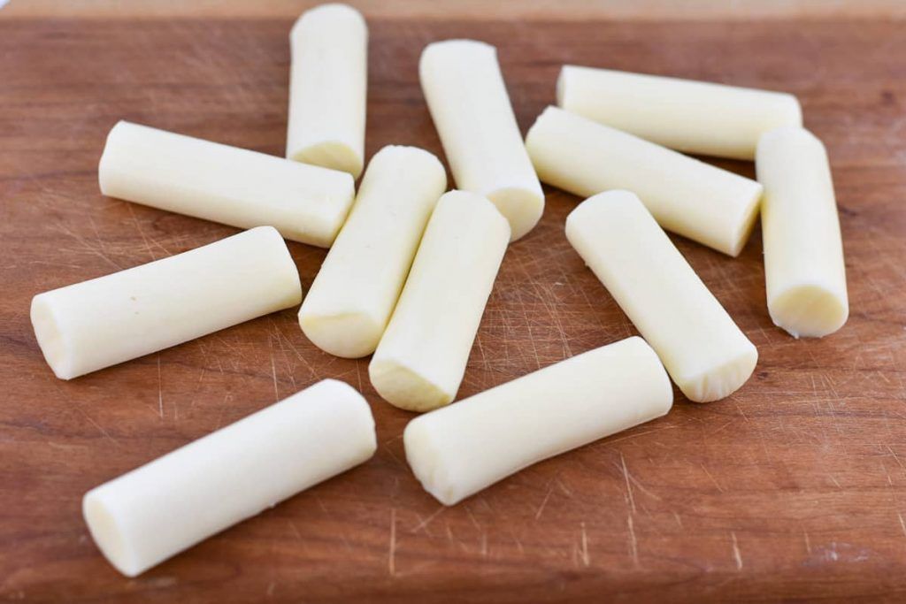 baked-mozzarella-sticks-on-cutting-board