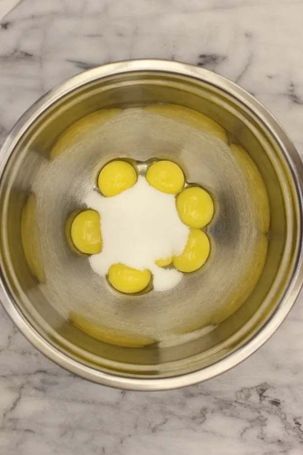 in-a-bowl-mix-together-the-egg-yolks-and-the-second-half-of-the-granulated-white-sugar