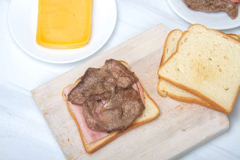 AssemblingFrancesinhaSandwich_AuthenticFoodQuest