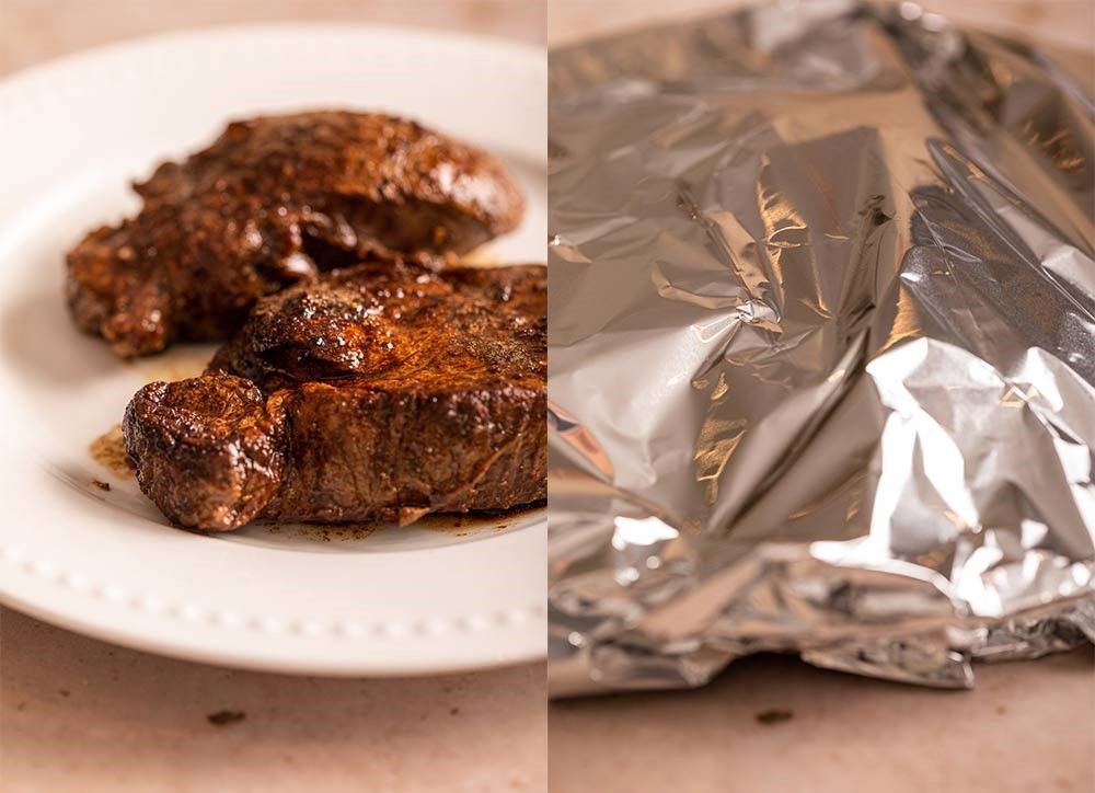 filet-mignon-resting-on-a-white-plate-covred-in-foil-to-rest