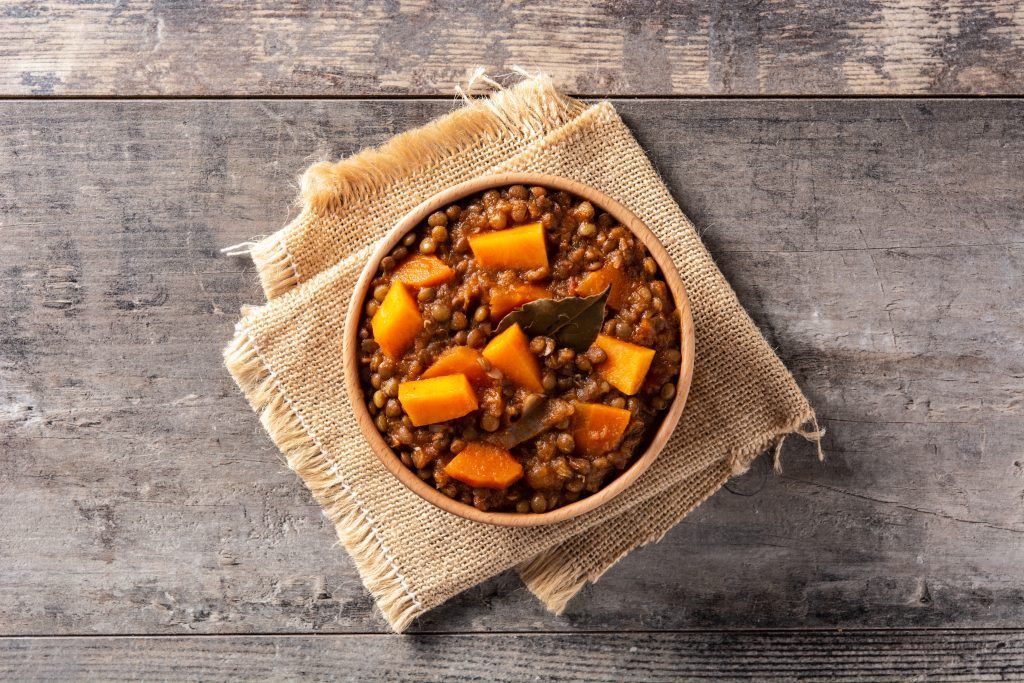 Lentil stew ragout with pumpkin and carrot in bowl